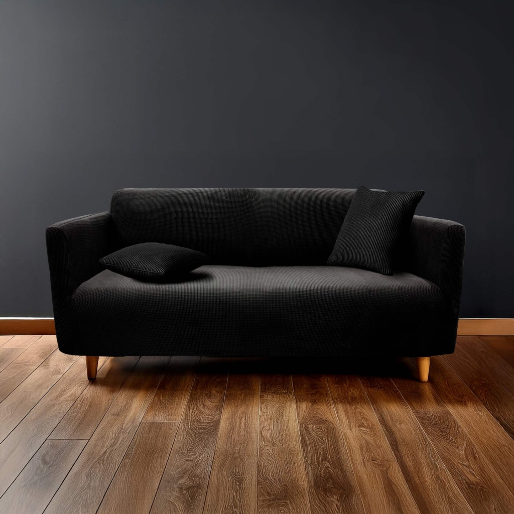  Housse de canapé extensible 225 x 245 x 60 cm – Polyester gaufré uni – Modèle SACHA Noir